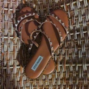 Tan sandals with silver stud accents